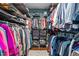 Large walk-in closet with custom shelving, storage and plenty of space for organizing clothes and accessories at 676 Whitehurst, Pittsboro, NC 27312