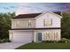 Charming two-story home with a manicured lawn, a two-car garage, and inviting curb appeal at 7029 Peppermill Way, Rocky Mount, NC 27804