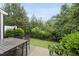 Well-maintained backyard featuring green space, greenery, a fence, and outdoor seating area at 707 Newlyn Dr, Raleigh, NC 27606