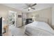 Comfortable bedroom with a ceiling fan and an attached office space with natural light at 707 Newlyn Dr, Raleigh, NC 27606