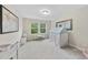 Bright bedroom featuring neutral walls, white carpet, a play tent and natural light from the double windows at 707 Newlyn Dr, Raleigh, NC 27606