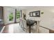 Elegant dining room with a large table, seating for eight, and a view of the outdoors at 707 Newlyn Dr, Raleigh, NC 27606