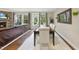 Elegant dining room with a large table, seating for eight, and a view of the outdoors at 707 Newlyn Dr, Raleigh, NC 27606