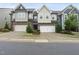 Inviting townhomes showcasing attached garages, landscaped front yards, and varied exterior designs at 707 Newlyn Dr, Raleigh, NC 27606