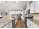 Well-appointed kitchen featuring granite countertops, stainless steel appliances, and ample cabinet space at 707 Newlyn Dr, Raleigh, NC 27606