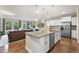 Modern kitchen island with granite countertops, stainless steel appliances, and open concept design at 707 Newlyn Dr, Raleigh, NC 27606