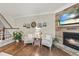 Cozy living room showcasing a stone fireplace, decor, and comfortable seating at 707 Newlyn Dr, Raleigh, NC 27606