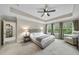 Bright main bedroom with neutral carpet and a picturesque window view for a serene retreat at 707 Newlyn Dr, Raleigh, NC 27606