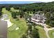 Breathtaking aerial shot showcasing the golf course and clubhouse with surrounding lush landscape at 71012 Russell, Chapel Hill, NC 27517