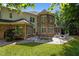 Exterior rear view of home showcasing a large patio and backyard at 71012 Russell, Chapel Hill, NC 27517