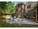 Rear exterior view showcasing patio, outdoor seating and backyard at 71012 Russell, Chapel Hill, NC 27517