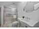 Bathroom featuring a glass-enclosed shower, pedestal sink, and marble accents at 71012 Russell, Chapel Hill, NC 27517