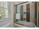 Bathroom view showcasing shower over tub with glass doors and tile surround at 71012 Russell, Chapel Hill, NC 27517