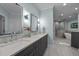 Modern bathroom featuring double sinks, a walk-in shower, and a standalone tub at 71012 Russell, Chapel Hill, NC 27517