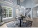 Bright dining room with large windows and modern chandelier at 71012 Russell, Chapel Hill, NC 27517