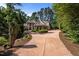 Charming brick home featuring manicured landscaping and a welcoming circular driveway at 71012 Russell, Chapel Hill, NC 27517