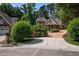 Stately brick home featuring meticulously landscaped grounds and a circular driveway at 71012 Russell, Chapel Hill, NC 27517