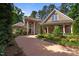 Beautiful brick home with stone accents, mature landscaping, and a spacious circular driveway at 71012 Russell, Chapel Hill, NC 27517