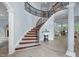 Elegant foyer with a curved staircase, hardwood floors, and ample natural light at 71012 Russell, Chapel Hill, NC 27517