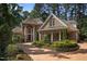 Exterior facade of a home showcasing columns and landscaping at 71012 Russell, Chapel Hill, NC 27517