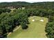 Picturesque golf course aerial showcasing manicured greens, bunkers, and tree-lined fairways at 71012 Russell, Chapel Hill, NC 27517