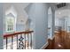Hallway featuring hardwood floors and light blue walls at 71012 Russell, Chapel Hill, NC 27517