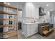 Gray and white kitchen with pull out cabinets and access to other rooms at 71012 Russell, Chapel Hill, NC 27517