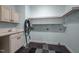 Functional laundry room features a sink, cabinets, and ample shelving for storage and organization at 71012 Russell, Chapel Hill, NC 27517