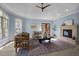 Bright living room features a fireplace, vaulted ceilings, and lots of natural light from large windows at 71012 Russell, Chapel Hill, NC 27517