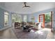 Bright living room features a fireplace, vaulted ceilings, and lots of natural light from large windows at 71012 Russell, Chapel Hill, NC 27517