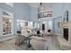 Open floor plan showcases a light-filled living room with fireplace and views to kitchen at 71012 Russell, Chapel Hill, NC 27517