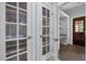 Well-organized pantry with glass-paneled doors and ample shelving for storage convenience at 71012 Russell, Chapel Hill, NC 27517