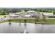 Aerial view of the community with a lake and a shopping center nearby at 72 S Grey Abbey Dr, Clayton, NC 27527