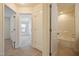 Bright bathroom features a shower and tub combination with white tiled walls at 72 S Grey Abbey Dr, Clayton, NC 27527