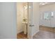 Elegant half bathroom featuring a stylish pedestal sink and bright lighting at 72 S Grey Abbey Dr, Clayton, NC 27527