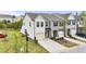 Stylish townhome showcasing well-kept lawns, private driveways, and modern design at 72 S Grey Abbey Dr, Clayton, NC 27527
