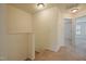 Second floor hallway with neutral carpet and door entries to bedrooms at 72 S Grey Abbey Dr, Clayton, NC 27527