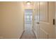 Hallway leading to a bedroom with plush carpeting and bright, natural light at 72 S Grey Abbey Dr, Clayton, NC 27527