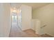 Hallway with neutral carpet and white trim doors leading to bedrooms at 72 S Grey Abbey Dr, Clayton, NC 27527