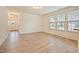 Light filled living room with multiple windows and wood flooring at 72 S Grey Abbey Dr, Clayton, NC 27527