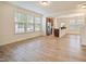 Open-concept living area with wood floors and views of the kitchen at 72 S Grey Abbey Dr, Clayton, NC 27527