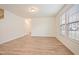 Bright living room with hardwood floors, large windows, and neutral paint at 72 S Grey Abbey Dr, Clayton, NC 27527
