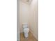 Compact powder room with standard toilet and neutral tile flooring at 72 S Grey Abbey Dr, Clayton, NC 27527
