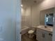 Clean and simple bathroom featuring white fixtures and tile flooring at 753 Swim Cave Ln, Wendell, NC 27591