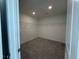 Walk-in closet with shelving and plush carpeting offering ample storage space at 753 Swim Cave Ln, Wendell, NC 27591