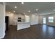 Spacious open-concept living room and kitchen, perfect for entertaining, complete with hardwood flooring at 753 Swim Cave Ln, Wendell, NC 27591