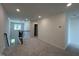 Upstairs loft area with neutral carpet, white walls, and recessed lighting at 753 Swim Cave Ln, Wendell, NC 27591