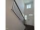 The home's staircase features a white door and dark wooden floors, accented with natural light at 753 Swim Cave Ln, Wendell, NC 27591