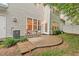 Backyard with patio and outdoor seating, ideal for relaxation and entertaining near the rear entrance at 8013 Morrell Ln, Durham, NC 27713