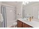 This bathroom features a vanity with storage and a bathtub shower combo at 8013 Morrell Ln, Durham, NC 27713